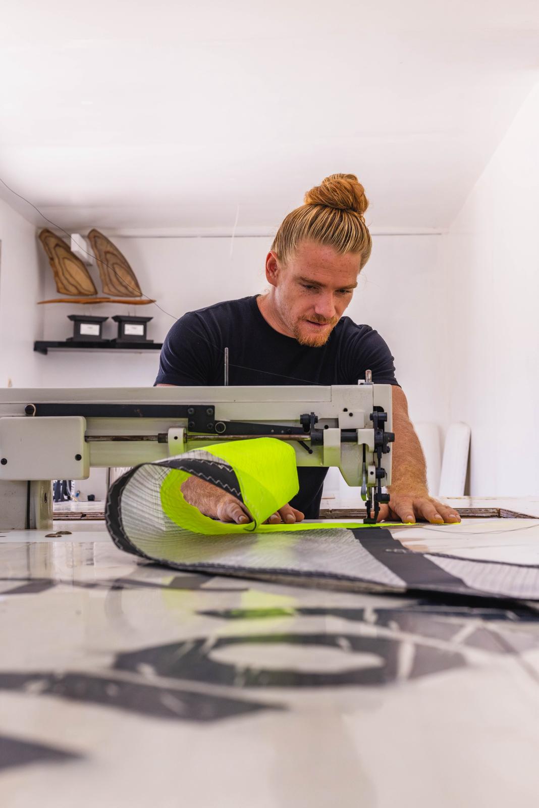 Rolling out monofilm and neon panels to cut a HeYYou sail